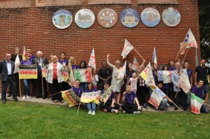 All 6 Mosaics on the wall of the Leisure Centre at St Nicholas Park with the team of people who took part.